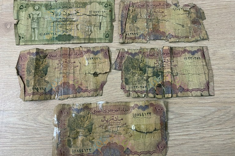 Tattered Yemeni bank notes