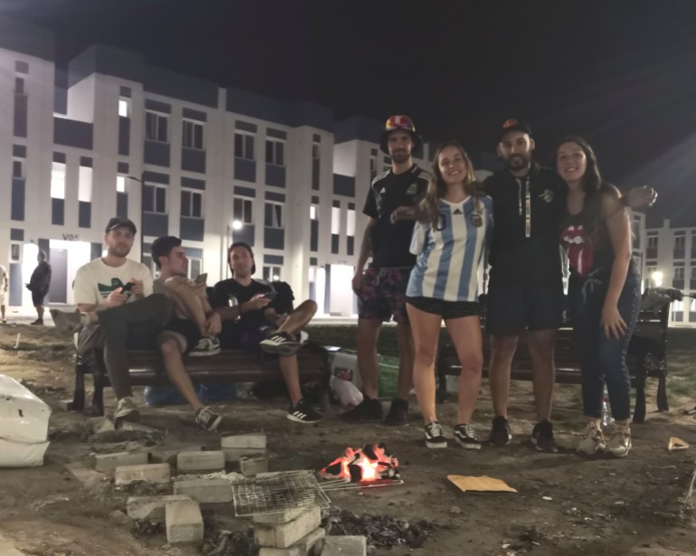 Tatiana Quartucci (second from left) and Mattias (second from right) travelled to the World Cup in Qatar from Lionel Messi's hometown Rosario in Argentina [Hafsa Adil/Al Jazeera]