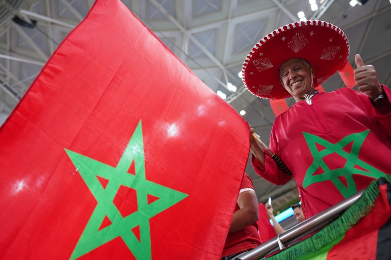 A Morocco fan cheers on his side