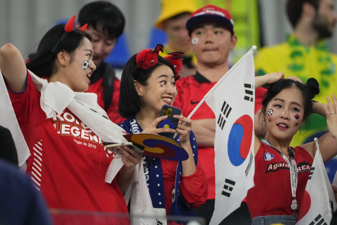 Fans of South Korea get ready to watch the game.