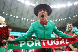 Portugal fans celebrate in the stands.