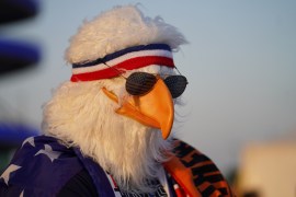A USA fan sports a bald eagle mask ahead of the team&#39;s match against the Netherlands. The round of 16 clash ended with the Netherlands beating the USA 3-1.[Sorin Furcoi/Al Jazeera]