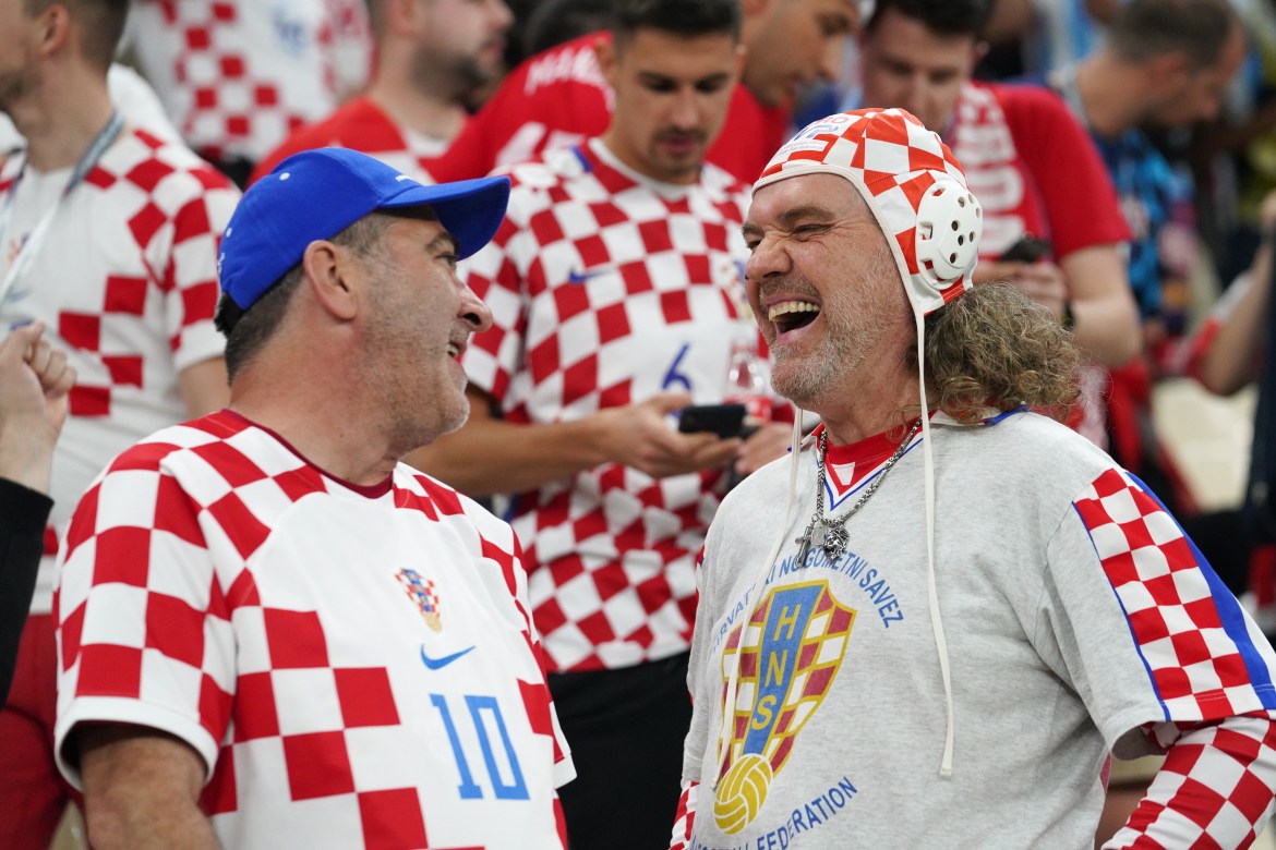 Croatia fans celebrate in the stands before the match