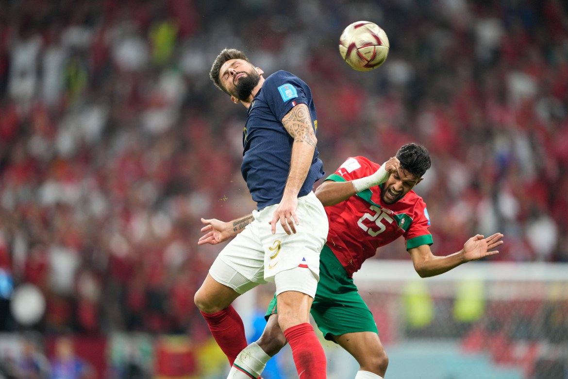 Olivier Giroud #9 in the air with Yahya Attiat-Allah