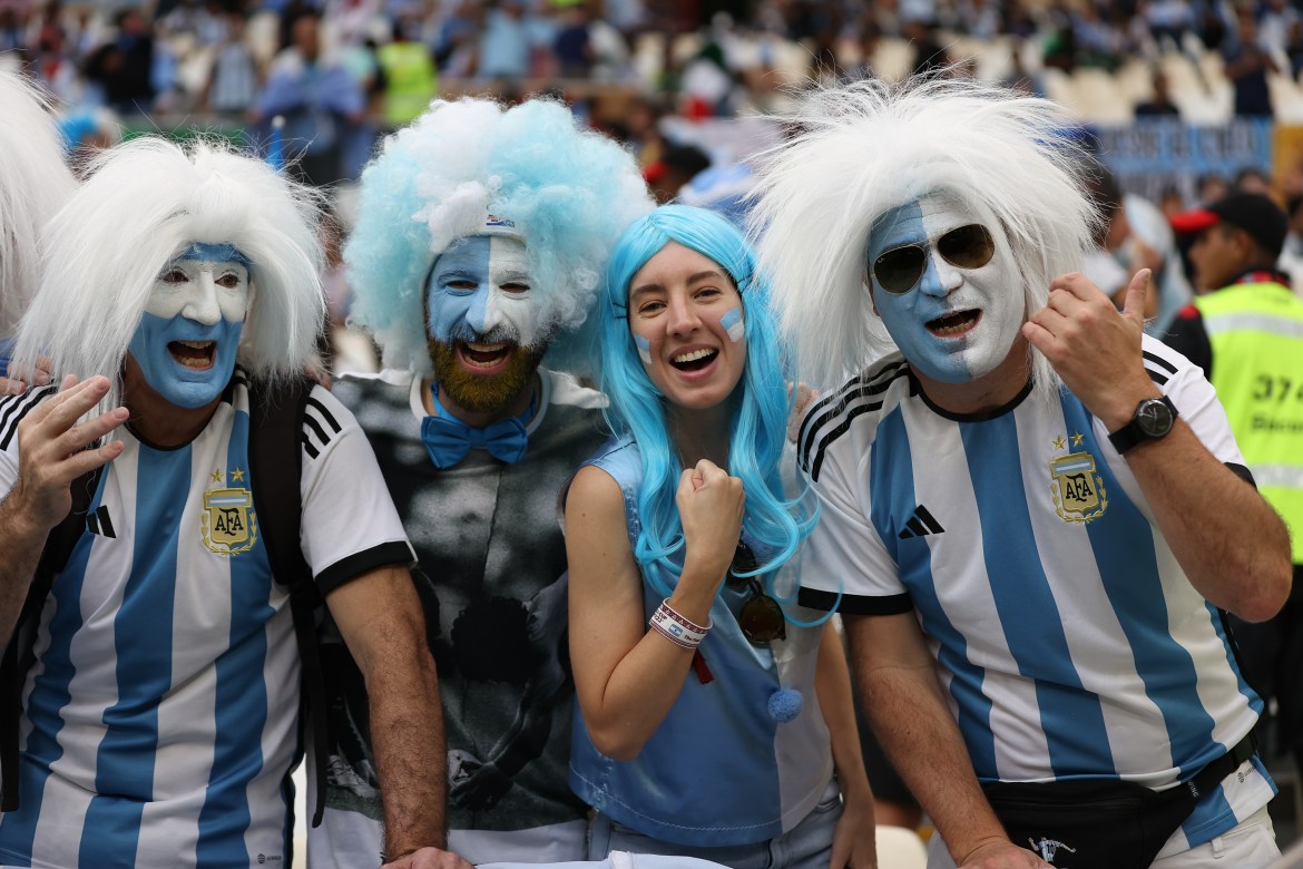 Argentina fans celebrating in the stands before the match.