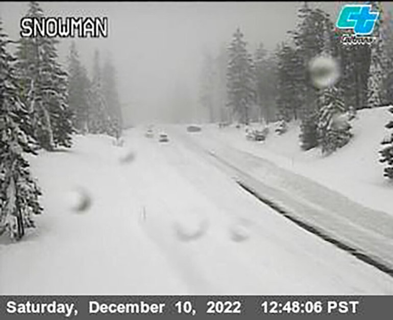 Snow covers a road in the mountains of California