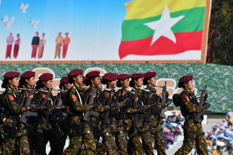 Members of the Myanmar military march at a parade ground to mark the country's Independence Day in Naypyidaw on January 4, 2023. - Myanmar's junta announced an amnesty for 7,000 prisoners to mark Independence Day on January 4 following a show of force in the capital, days after increasing democracy figurehead Aung San Suu Kyi's jail term to 33 years. (Photo by AFP)
