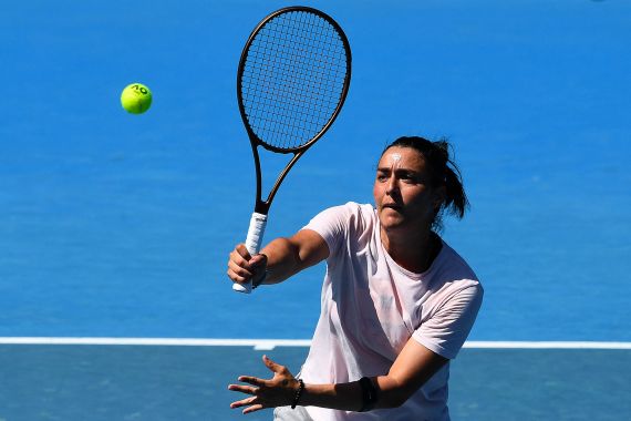 Tunisia's Ons Jabeur hits a return during a practice session ahead of the Australian Open tennis tournament in Melbourne on January 14, 2023.