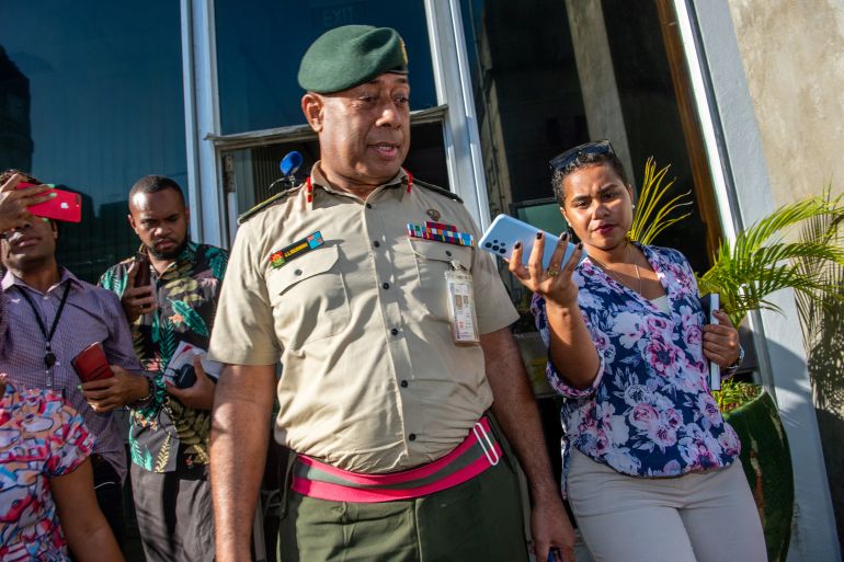 Fijian Commander of the Military Forces Jone Kalouniwai talks to the press outside the Prime Minister's office in Suva