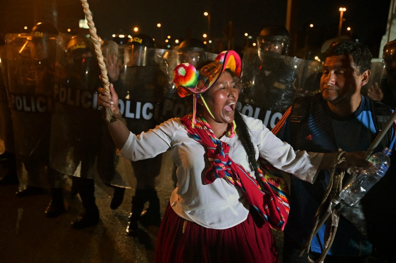 An indigenous woman shouts slogans during a protest demanding the resignation of Peru's President Dino Boluarte in Lima on January 23, 2023.