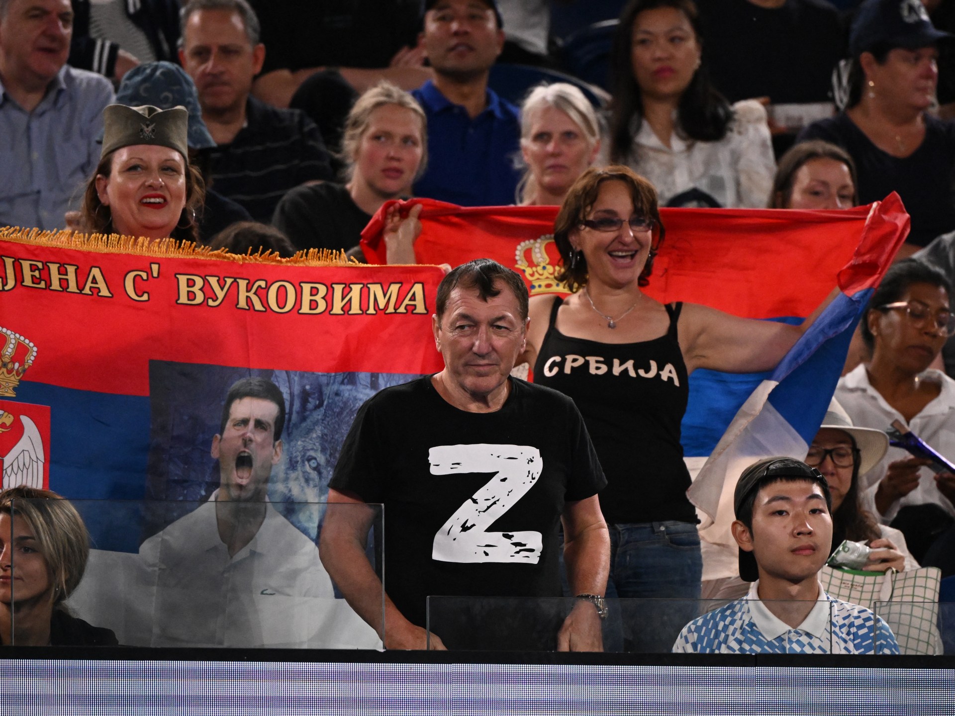 Djokovic’s father poses with tennis fans waving pro-Russia flags