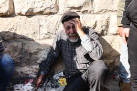 An elderly Palestinians man mourns the death one of the nine reported victims [Jaafar Ashtiyeh/AFP]