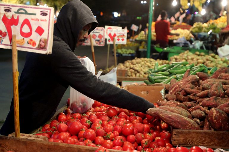 A man shops at a vegetable market in Cairo, Egypt
