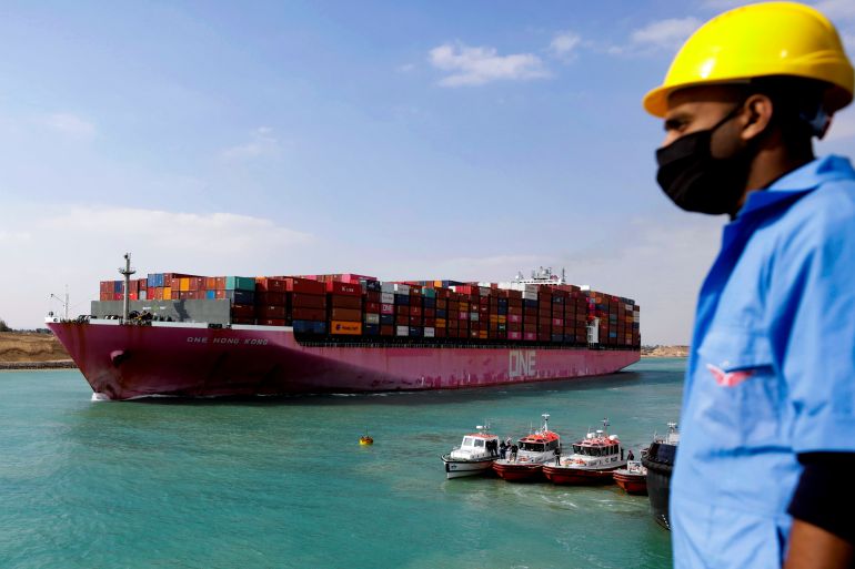 Shipping containers are seen on a ship, belonging to Ocean Network Express (ONE), moving through the Suez Canal in Suez, Egypt February 15, 2022. Picture taken February 15, 2022