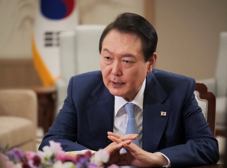 South Korean President Yoon Suk-yeol speaks during an interview with the Reuters news agency.