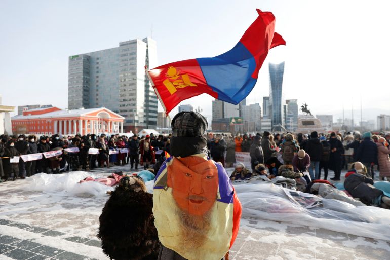 People take part in a demonstration against government corruption at Sukhbaatar Square in Ulaanbaatar, Mongolia.