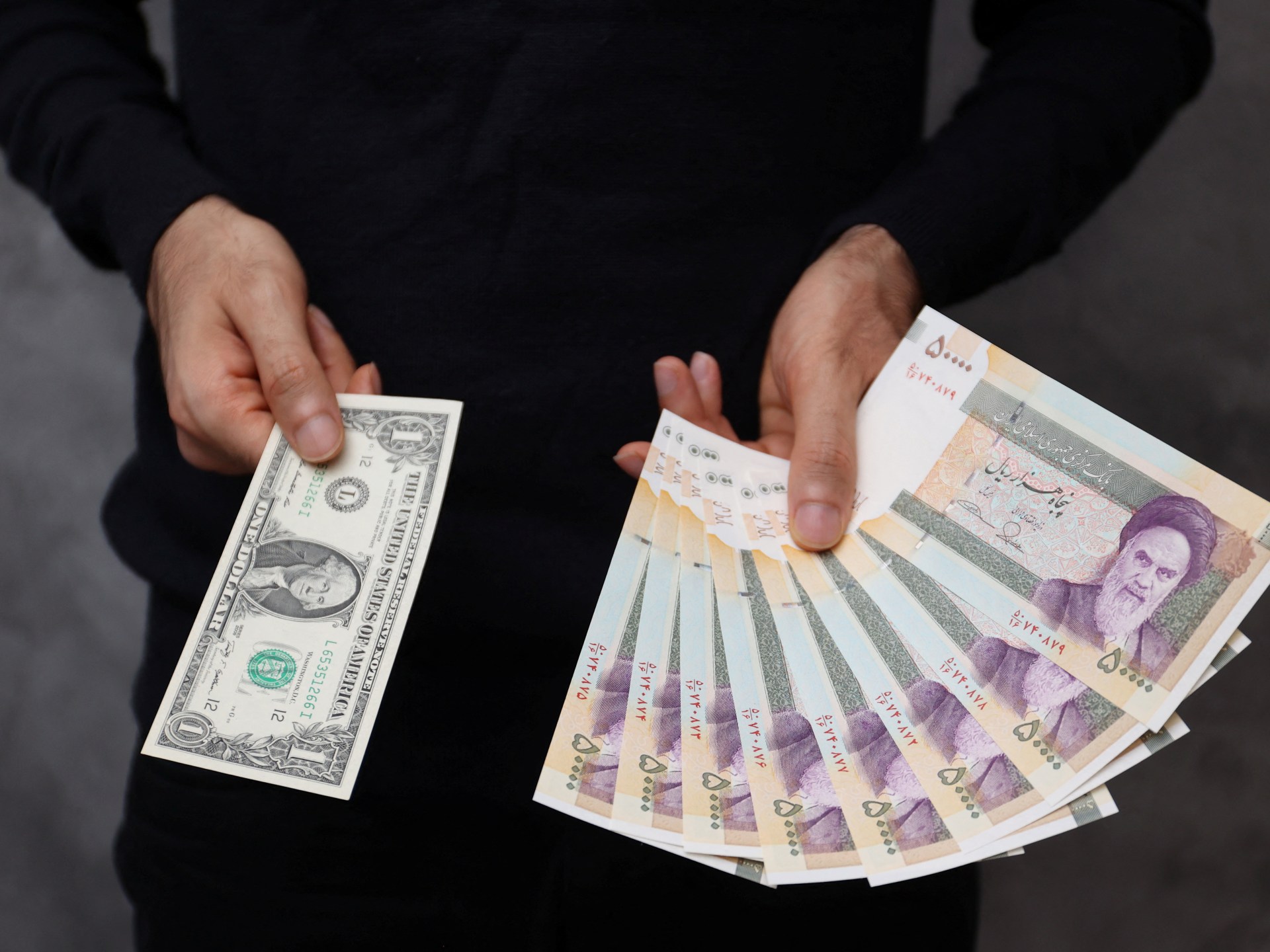 Iran’s currency hits record low amid tensions with the West