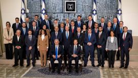 Israeli President Isaac Herzog and newly-elected Prime Minister Benjamin Netanyahu pose for a group photograph with members of the new Israeli government after their swearing-in ceremony, at the president's residence in Jerusalem, December 29, 2022. REUTERS/Oren Ben Hakoon ISRAEL OUT. NO COMMERCIAL OR EDITORIAL SALES IN ISRAEL. TPX IMAGES OF THE DAY