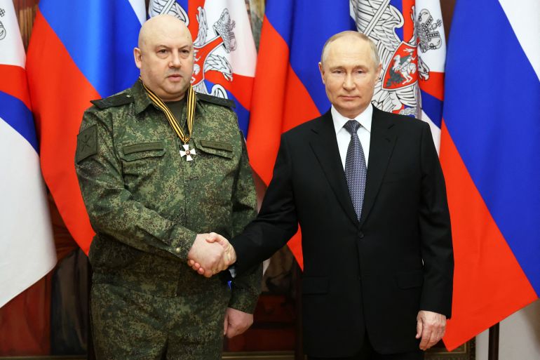 Russian President Vladimir Putin awards General Sergei Surovikin, commander of Russian forces in Ukraine, with the Order of St. George, Third Class, at the headquarters of the Southern Military District in Rostov-on-Don, Russia December 31, 2022. Sputnik/Mikhail Klimentyev/Kremlin via REUTERS ATTENTION EDITORS - THIS IMAGE WAS PROVIDED BY A THIRD PARTY.