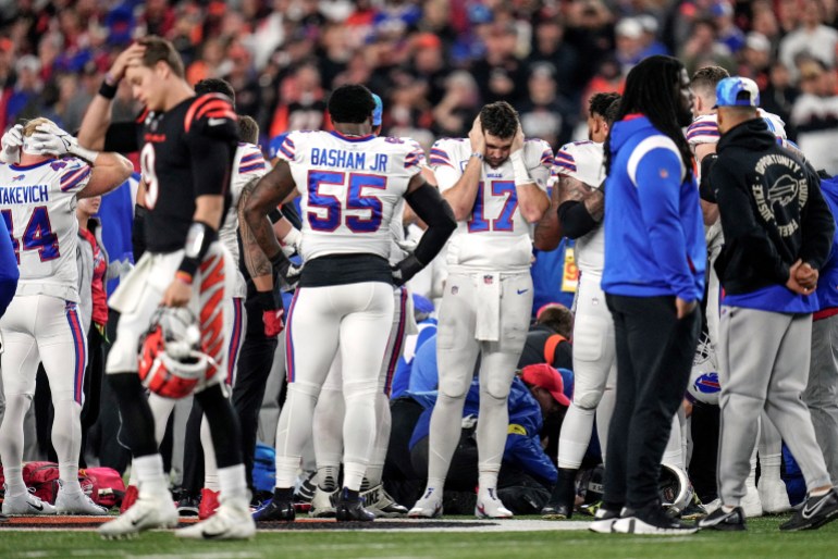 January 2, 2023;  Cincinnati, Ohio, USA;  The Buffalo Bills gather as an ambulance parks on the field as CPR is administered to Buffalo Bills safety Damar Hamlin (3) after a play in the first quarter of the Week 17 NFL game between the Cincinnati Bengals and the Buffalo Bills in the Paycor Stadium in Downtown Cincinnati