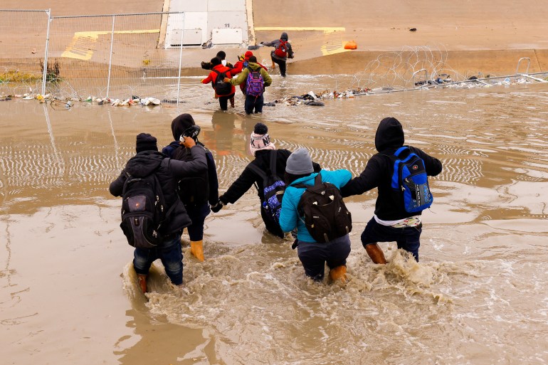 Asylum seekers cross the Rio Bravo River