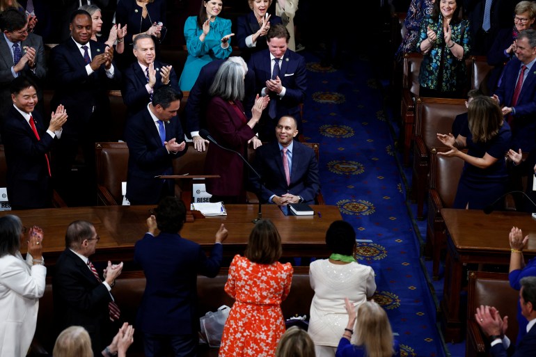 Hakeem Jeffries is applauded in the House by his fellow Democrats.