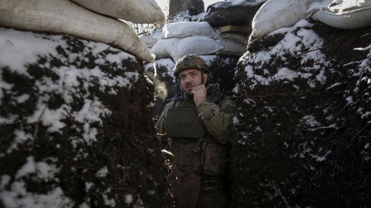 A Ukrainian serviceman stands in a trench on the front line in Donetsk region, Ukraine, January 7, 2023