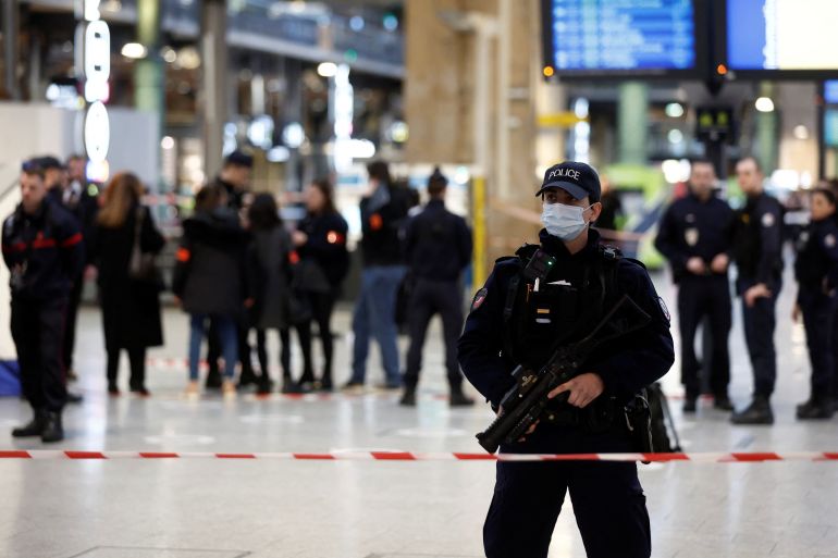 French police secure the area after a man with a knife wounded several people at the Gare du Nord