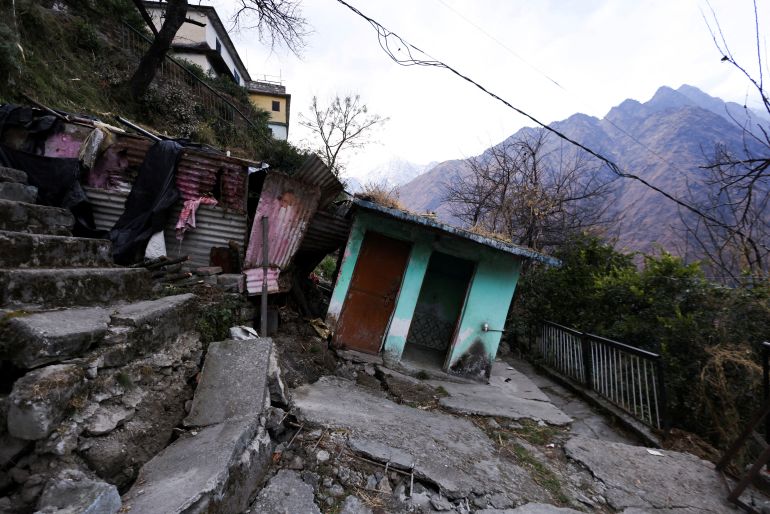 Damaged stairs leading to a residential building and a tilted room are seen in Joshimath, in the northern state of Uttarakhand, India, January 13, 2023. REUTERS/Anushree Fadnavis
