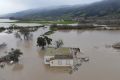 A home on agricultural land is seen amid flooding from the Salinas River in Salinas, California, U.S., January 13, 2023. REUTERS/David Swanson