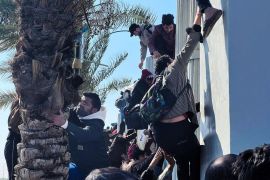 Soccer fans attempt to enter the Basra International Stadium