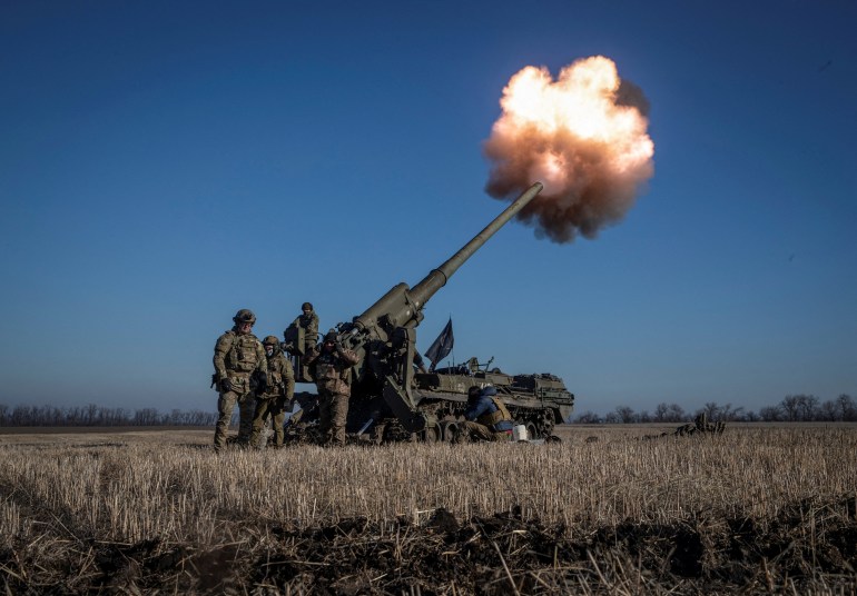 Ukrainian soldiers fire 2S7 Pion self-propelled howitzers towards Russian positions near Bakhmut.