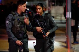 Israel forces stand guard at the scene of a shooting attack in Neve Yaacov which lies on occupied land that Israel annexed to Jerusalem after the 1967 Middle East war.