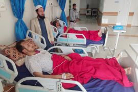 Men injured in a suicide blast in a mosque in Peshawar recover at a hospital in the city [Fayaz Aziz/Reuters]