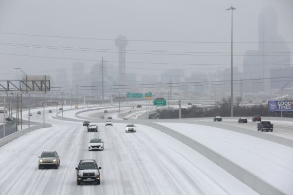 Cars on a snow-covered freeway in Dallas, Texas.