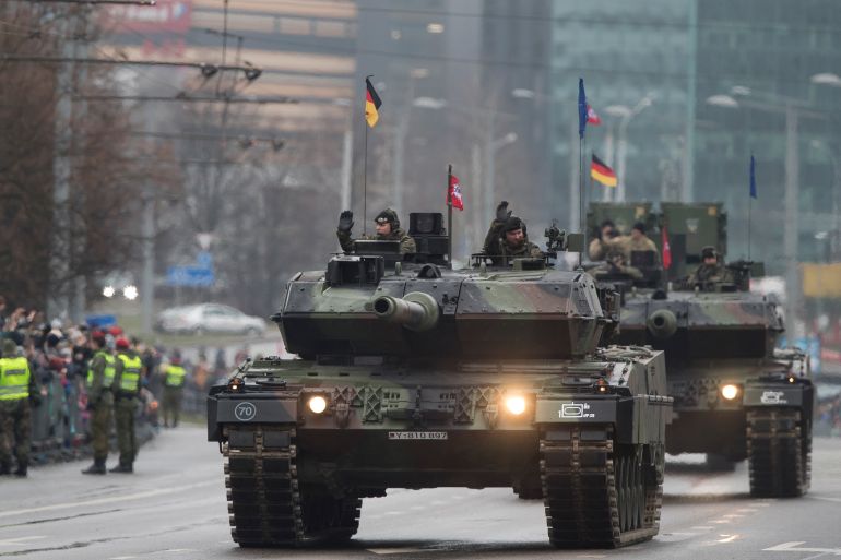 Members of the German Army with Leopard 2 tanks participate in military parade to celebrate the 100th anniversary of the Lithuanian military on Armed Forces Day in Vilnius, Lithuania.