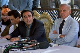 Pakistan opposition party leaders Bilawal Bhutto Zardari, center, and Shahbaz Sharif, right, give a press conference regarding current political situation, in Islamabad, Pakistan, Monday, April 4, 2022. Pakistan's top court began hearing arguments Monday on whether Prime Minister Imran Khan and his allies had the legal right to dissolve parliament and set the stage for early elections. (AP Photo/F. Khan)