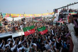 Supporters of Pakistan's main opposition 'Tehreek-e-Insaf party' listen the speech of their leader Imran Khan at a rally in Lahore, Pakistan, Saturday, October 29 2022