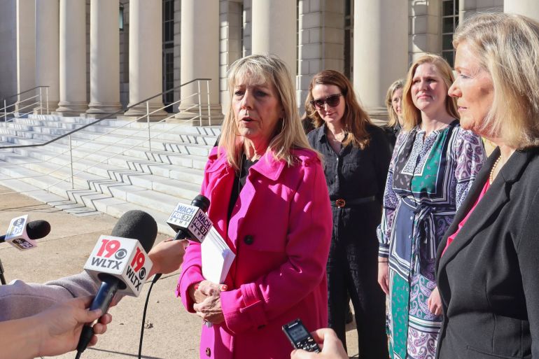 Vicki Ringer of Planned Parenthood speaks to reporters