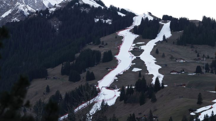 A view of the course, at left, of an alpine ski, men's World Cup giant slalom competition, in Adelboden, Switzerland, Friday, Jan. 6, 2023, the day before the race. Sparse snowfall and unseasonably warm weather in much of Europe is allowing green grass to blanket many mountaintops across the region where snow might normally be. It has caused headaches for ski slope operators and aficionados of Alpine white this time of year.(AP Photo/Gabriele Facciotti)