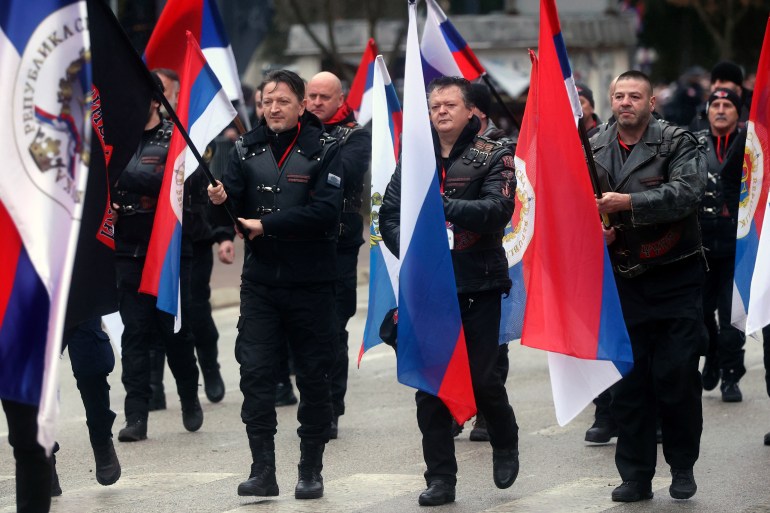 Local members of Russian Night Wolves Motorcycle Club march during a parade marking the 31st anniversary of the Republic of Srpska in Istocno Sarajevo, Bosnia, Monday, Jan. 9, 2023. Thousands of flag-waving people gathered on the outskirts of Sarajevo to celebrate an outlawed holiday associated with the country's brutal inter-ethnic war in the 1990s and attend a military-style parade organized for the occasion and used by Bosnian Serb separatist leader, Milorad Dodik, to showcase his allegiance to Russia. (AP Photo/Armin Durgut)