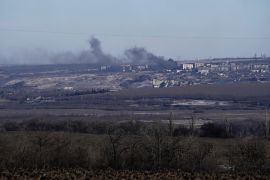 Smoke billows during fighting between Ukrainian and Russian forces in Soledar, Donetsk region, Ukraine, Wednesday, Jan. 11, 2023. (AP Photo/Libkos)