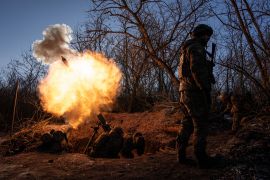 Ukrainian servicemen fire a 120mm mortar towards Russian positions at the frontline near Bakhmut, Donetsk region, Ukraine, Wednesday, Jan. 11, 2023. (AP Photo/Evgeniy Maloletka)