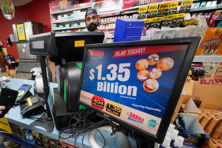 A Mega Million sign displays the estimated jackpot of $1.35 Billion