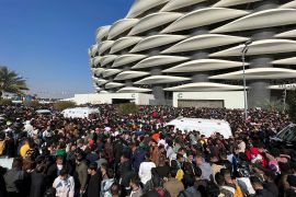 Iraqi soccer fans try to enter the Basra International Stadium in Basra, Iraq, Thursday, January 19, 2023. A stampede outside the stadium killed at least four people and injured many more. (Anmar Khalil/AP Photo)