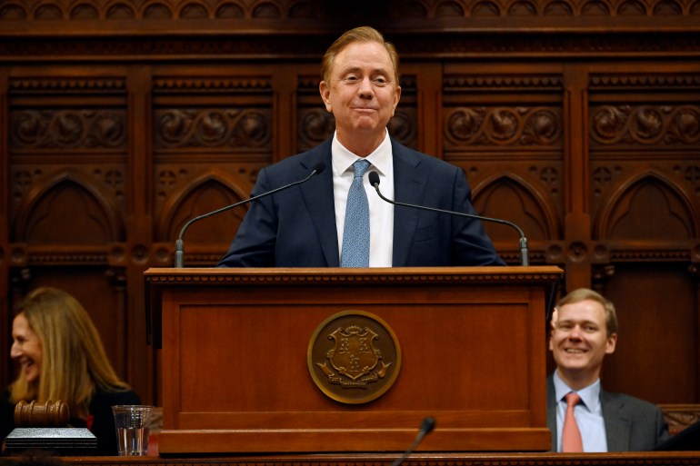 Ned Lamont at a lectern at the Connecticut State Capitol.
