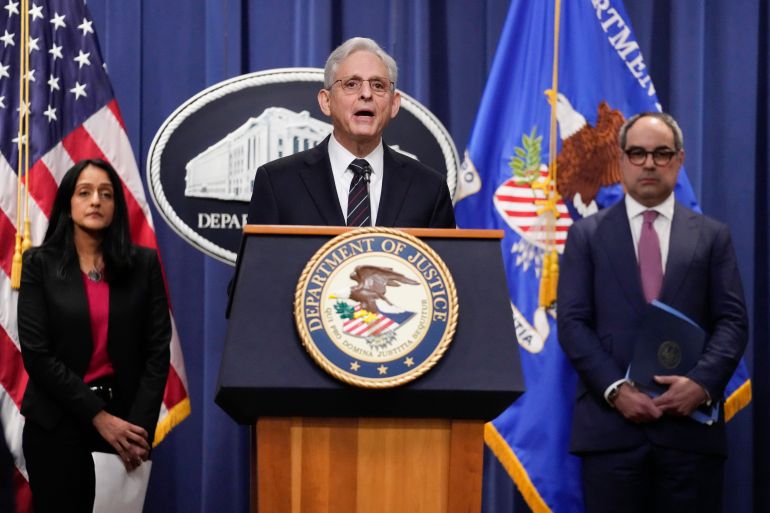 Attorney General Merrick Garland, joined by Associate Attorney General Vanita Gupta and Assistant Attorney General Jonathan Kanter of the Justice Department's Antitrust Division, speaks from a lectern at the Department of Justice in Washington, DC, on Tuesday.