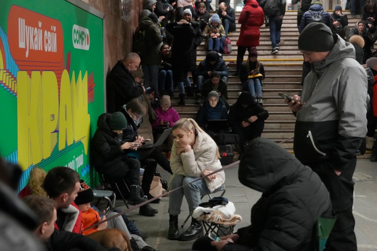 Ukrainians waiting in a train station