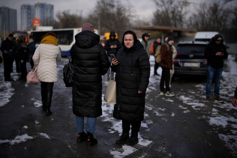 Ukrainians waiting after a missile attack