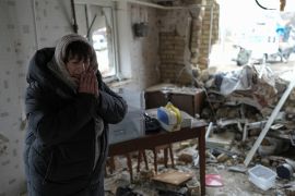 Halina Panasian reacts inside her destroyed house after a Russian rocket attack in Hlevakha, Kyiv region, Ukraine [Roman Hrytsyna/AP Photo]